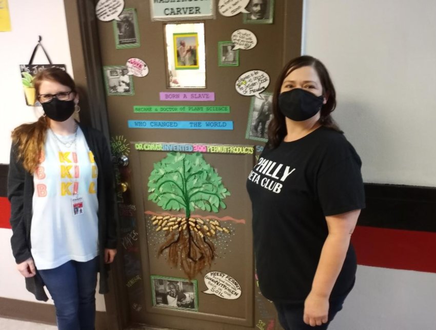 The first-period classes of Mary Kate Collins Hollingsworth, left, and Jennifer Johnson tied for first in Philadelphia High School’s Civil Rights door decoration contest.